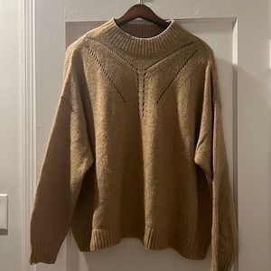 Loose fitting caramel BR sweater with neck/chest detailing